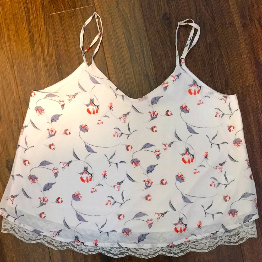White T with floral design, never worn before.